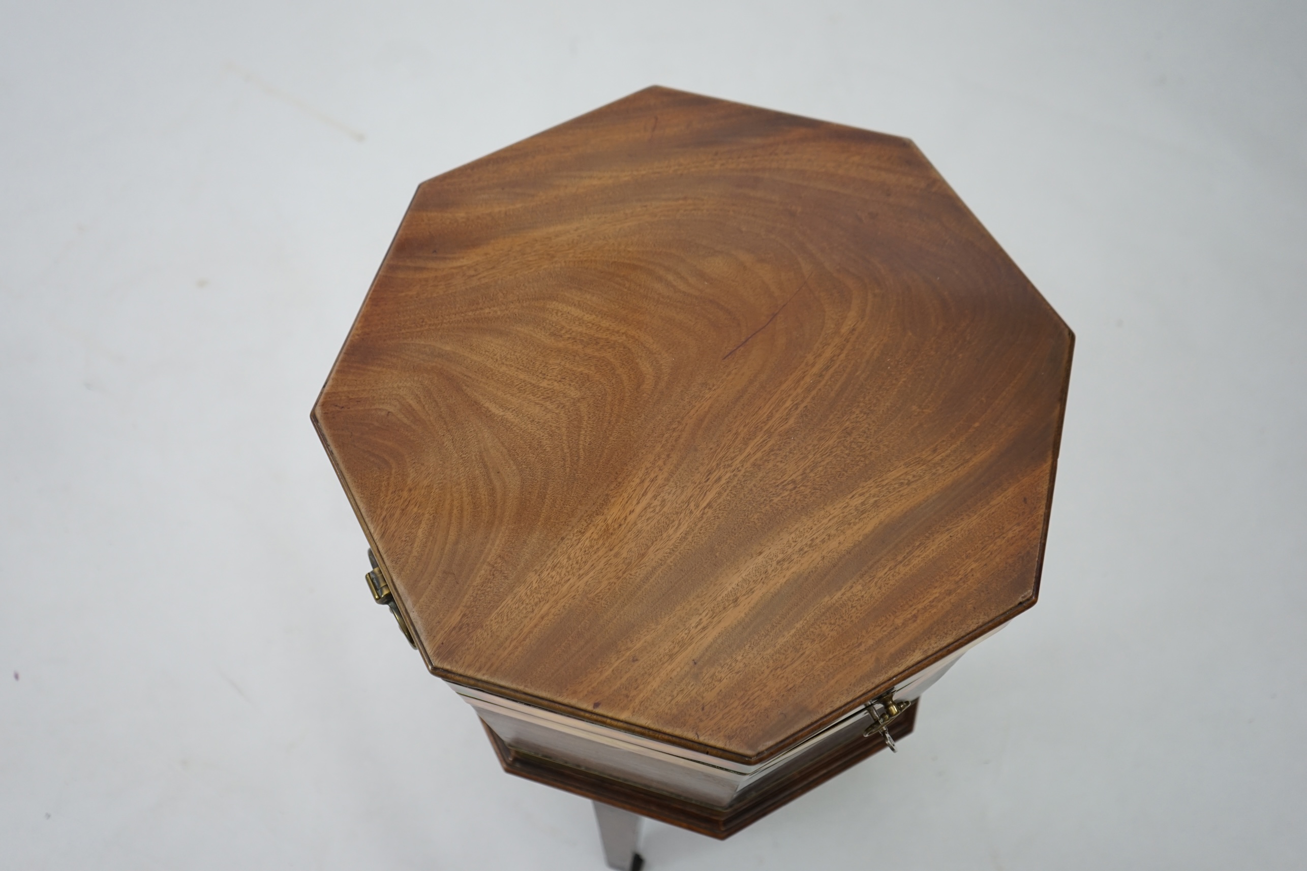 A George III mahogany triple brass banded octagonal cellarette